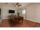 Spacious game room with a pool table, ceiling fan, and wood-look flooring at 11430 Trotting Down Dr, Odessa, FL 33556