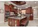 Gourmet kitchen featuring a large island, stainless steel appliances, and wood cabinetry at 11430 Trotting Down Dr, Odessa, FL 33556