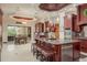 Gourmet kitchen features custom cabinetry, large island with seating, and an adjacent breakfast nook with outdoor access at 11430 Trotting Down Dr, Odessa, FL 33556