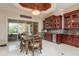 The spacious kitchen includes a built-in bar area with glass cabinets and a wine cooler, perfect for entertaining at 11430 Trotting Down Dr, Odessa, FL 33556