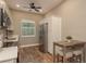 Kitchen featuring stainless steel appliances, wood-look floors, white cabinets and breakfast nook at 11430 Trotting Down Dr, Odessa, FL 33556
