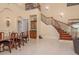 Open-concept home featuring a stairway, wine closet and dining room, perfect for entertaining at 11430 Trotting Down Dr, Odessa, FL 33556