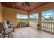 Inviting outdoor patio with screened windows offering scenic views at 11430 Trotting Down Dr, Odessa, FL 33556