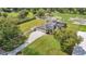 Aerial view of a beautiful home, long drive and equestrian paddock set on well-manicured acreage at 12637 Tyler Run Ave, Odessa, FL 33556
