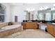 A luxurious bathroom with a soaking tub, granite countertops, and a well-lit vanity at 12637 Tyler Run Ave, Odessa, FL 33556