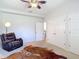 Bedroom features two closets, a dresser, and an armchair, providing ample closet space at 12637 Tyler Run Ave, Odessa, FL 33556
