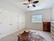 Bedroom with two closets, a dresser, and a ceiling fan, offering ample storage space at 12637 Tyler Run Ave, Odessa, FL 33556