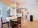 Dining room features a chandelier and a large window at 12637 Tyler Run Ave, Odessa, FL 33556