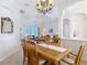 Open-concept floorplan with columns views dining room, living room and entrance, tiled floors throughout at 12637 Tyler Run Ave, Odessa, FL 33556