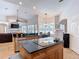 Open kitchen layout with breakfast bar island, eat in dining area, and living room at 12637 Tyler Run Ave, Odessa, FL 33556