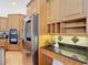 Kitchen with stainless steel appliances, granite countertops, and plenty of cabinets at 12637 Tyler Run Ave, Odessa, FL 33556