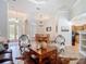 Open-concept floorplan shows living room, dining room and entrance. Home has neutral tile floors throughout at 12637 Tyler Run Ave, Odessa, FL 33556