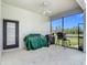 Covered patio with a ceiling fan and barbecue equipment, offering an outdoor space for dining and recreation at 12637 Tyler Run Ave, Odessa, FL 33556