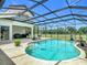 Screened-in pool area featuring chaise lounges, lush potted plants, barbecue and backyard views at 12637 Tyler Run Ave, Odessa, FL 33556