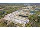 An aerial view of community construction with ponds, roads, and the foundations of homes at 12801 Castle Oaks Dr, Hudson, FL 34669