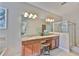 Dual vanity bathroom features granite countertops, lots of lighting, and a glass-enclosed shower at 13113 Green Violet Dr, Riverview, FL 33579