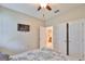 Comfortable bedroom featuring a ceiling fan, television, and closet at 13113 Green Violet Dr, Riverview, FL 33579