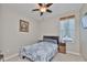 Cozy bedroom with ceiling fan and large window at 13113 Green Violet Dr, Riverview, FL 33579
