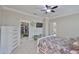 Well-appointed main bedroom featuring a closet, ceiling fan, and dresser at 13113 Green Violet Dr, Riverview, FL 33579