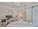 Office/bedroom featuring a chandelier and an ensuite bathroom at 13113 Green Violet Dr, Riverview, FL 33579