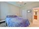 Comfortable bedroom featuring a ceiling fan, a closet, and ensuite bathroom at 13113 Green Violet Dr, Riverview, FL 33579