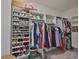 Walk-in closet with multiple shelves and racks for optimal storage and organization at 13113 Green Violet Dr, Riverview, FL 33579