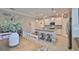 Well-appointed kitchen featuring a large island, stainless appliances, and a seamless transition to the dining area at 13113 Green Violet Dr, Riverview, FL 33579