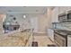 This bright kitchen showcases a large island, stainless appliances and lovely granite countertops at 13113 Green Violet Dr, Riverview, FL 33579