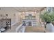 Kitchen with granite countertops, stainless steel appliances, white cabinets, and a center island with seating at 13113 Green Violet Dr, Riverview, FL 33579