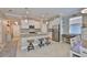Open-concept kitchen featuring an island, stainless steel appliances, and a seamless flow to the dining space at 13113 Green Violet Dr, Riverview, FL 33579