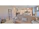 Open-concept living room showcases neutral colors and flows into the dining and kitchen areas at 13113 Green Violet Dr, Riverview, FL 33579