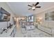 Open-concept living room features neutral colors and a seamless transition to the kitchen at 13113 Green Violet Dr, Riverview, FL 33579