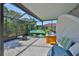 A beautiful outdoor patio featuring a hot tub, stylish seating, and a potting bench at 13113 Green Violet Dr, Riverview, FL 33579