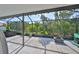 Screened-in patio featuring a view of the lush landscaping and greenery at 13113 Green Violet Dr, Riverview, FL 33579