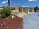 Charming single Gathering home with a unique stone and siding exterior and well-maintained landscaping at 13605 Stacey Dr, Hudson, FL 34667