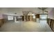 Large open-concept living room with framing, ready for renovation and personalization at 13605 Stacey Dr, Hudson, FL 34667