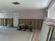 A work-in-progress living room needing new drywall and flooring, offering an exciting renovation project for homebuyers at 13605 Stacey Dr, Hudson, FL 34667