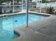 A refreshing, screened-in backyard pool with cool, clear water surrounded by a concrete deck near a waterfront canal at 13605 Stacey Dr, Hudson, FL 34667