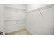 This is an empty walk-in closet with shelves for storing your items at 14317 Eagle Branch Dr, Nokomis, FL 34275