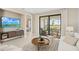 Bright living room with a patio view, comfortable furniture, modern decor, and a mounted flat screen TV at 14317 Eagle Branch Dr, Nokomis, FL 34275