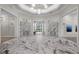 Elegant lobby with marble floors, high ceilings, and sophisticated decor, creating a welcoming ambiance at 14317 Eagle Branch Dr, Nokomis, FL 34275