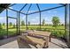 Outdoor patio with a dining set is perfect for enjoying meals in the open air at 14317 Eagle Branch Dr, Nokomis, FL 34275