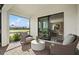The screened patio has brick floors and outdoor seating at 14317 Eagle Branch Dr, Nokomis, FL 34275
