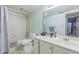 Bathroom featuring a shower tub combo, white vanity, and white flooring and tiling at 14820 Rue De Bayonne # 301, Clearwater, FL 33762
