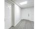 Condo hallway with two doorways, doors labeled 301 and 302 at 14820 Rue De Bayonne # 301, Clearwater, FL 33762
