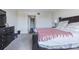 Spacious main bedroom featuring a queen-sized bed and adjoining closet and hallway at 14820 Rue De Bayonne # 301, Clearwater, FL 33762