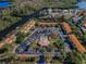 Aerial shot showcasing the community with a pool and lush green spaces, bordering a river at 1729 Seascape Cir # 102, Tarpon Springs, FL 34689