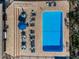 Aerial view of a sparkling community pool with lounge seating at 1729 Seascape Cir # 102, Tarpon Springs, FL 34689