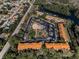 Aerial view of the community featuring a refreshing pool and well-manicured landscaping at 1729 Seascape Cir # 102, Tarpon Springs, FL 34689