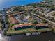 Scenic aerial view of community with a pool and waterfront access, offering stunning views at 1729 Seascape Cir # 102, Tarpon Springs, FL 34689